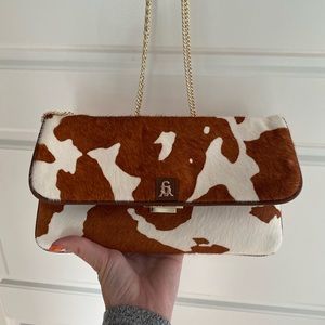 Steve Madden cow print crossbody purse with gold chain like new
